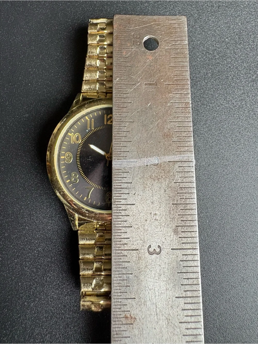 Gold Tone Watch with Black Dial